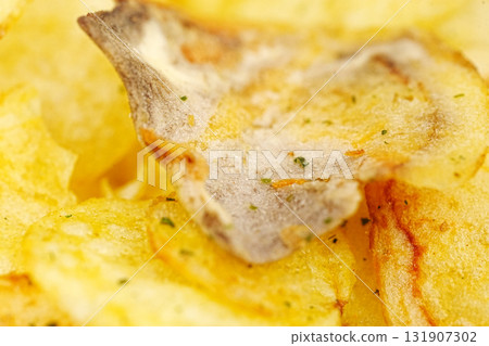 rotten potato chips. potato chips with spices. close up. 131907302