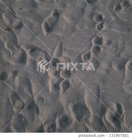 Footprints remaining on the beach 131907881