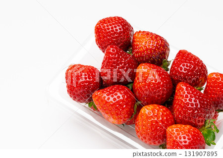 A transparent pack filled with fresh strawberries 131907895