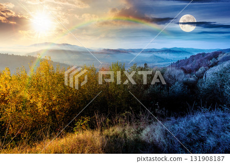 view from a mountain in to the foggy valley. day and night time change concept. beautiful autumn equinox. forested hills with sun and moon at twilight. picturesque alpine countryside scenery 131908187