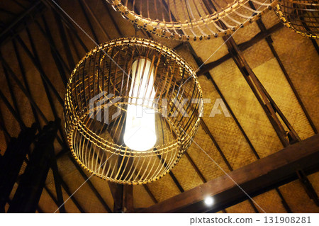Beautiful rattan lamp hanging on wooden ceiling in tropical resort in Thailand. Travel in Asian 131908281