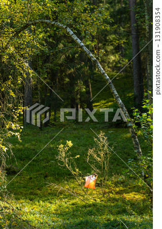 A prism marker and electronic composter at an orienteering control point A prism marker and electronic composter at an orienteering control point 131908354