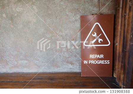 Repair in progress wooden sign Repair in progress wooden sign 131908388