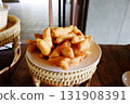 Chinese deep fried dough stick in white dish on woven tray and on wooden table. Breakfast in Thailand 131908391