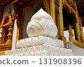 Floral statue and lotus stucco carvings decorated on pole head in the ancient golden temple 131908396