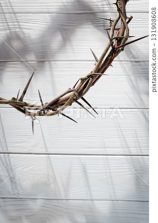 Jesus Christ Crown of thorns shadow against wooden textured gray surface, symbol spiritual pain and redemptive struggle Banner good Easter concept Christian friday background, Jesus Christ Crown of thorns shadow against wooden textured gray surface, symbol spiritual pain and redemptive struggle Banner good Easter concept Christian friday background, 131908608