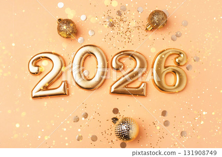 Golden 2026 on a peach color background. Golden 2026 on a peach color background. 131908749