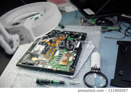 A detailed circuit board on a table in a lab A detailed circuit board on a table in a lab 131908907