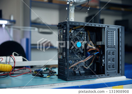 A computer case that features a fan mounted on top of it for cooling 131908908