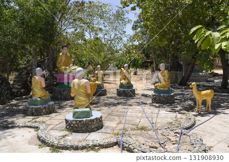 Gilded sculptures of Buddha, his disciples and deer in the garden near the Chua Tu Van Pagoda 131908930