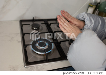 Keeping Warm During Winter by Using Gas Stove for Heat Conservation 131909395