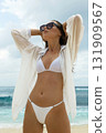 woman on the beach. Brunette Sexy girl in Bikini and Sunglasses 131909567