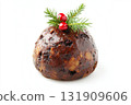 Festive fruit Christmas pudding isolated against a white background. Traditional dessert English cake with raisins, almonds, honey, rum, decorated with cranberries, holly leaves and chocolate glaze 131909606