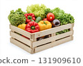 Fresh vegetables in wooden box. Healthy food on natural farm background. Harvested vegetables in a wooden crate on transparent background. Fruits and veggies. Organic produce and lush greenery. 131909610