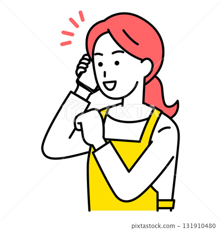 A woman in an apron happy to talk on her smartphone A woman in an apron happy to talk on her smartphone 131910480