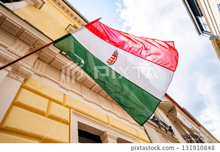 Hungarian National Flag Waving On A Facade 131910848
