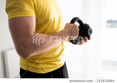 Sporty Man Doing Arm And Shoulder Home Workout With Dumbbells Sporty Man Doing Arm And Shoulder Home Workout With Dumbbells 131910864