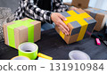 Girl At Home Packing A Cardboard Box, Representing The Concept Of Handmade Products For Selling Online 131910984