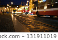 Night Traffic On A City Road: Cars With Lights On Going Against Blurry City Prague 131911019