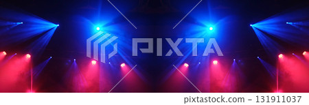 Stage Light Illuminates The Concert Stage With Smoke During A Musical Performance 131911037