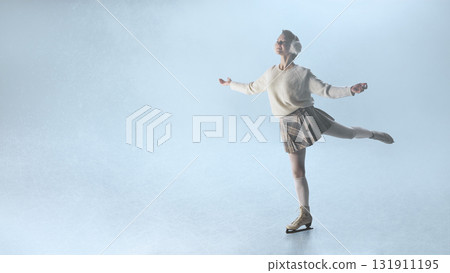 Elegant woman ice skater in plaid skirt performing graceful pose under soft snowy light 131911195