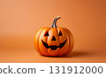Orange background with a large orange Halloween pumpkin 131912000