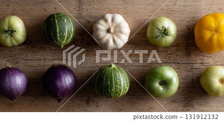 Vibrant fruits and vegetables are arranged neatly on a wooden surface, showcasing their freshness and colors 131912132