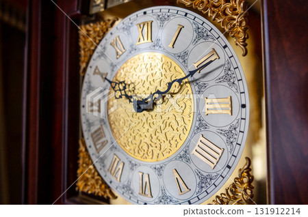 Dial of a vintage grandfather clock. Antique grandfather clock face. 131912214