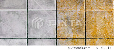 Tiles on the kitchen wall. Tiled wall half clean and half dirty, with a striking contrast. 131912217