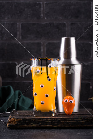 Spooky Halloween cocktail with eyes 131914192