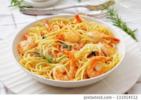 yummy spaghetti with shrimps in a white bowl 131914512
