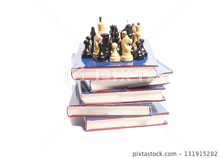 Chess on stack of books Chess on stack of books 131915282
