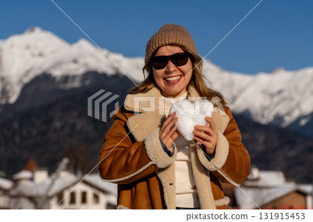 Snow Heart Mountains Woman: Winter joy, snowy Alps, Valentine's Day romantic gesture. Snow Heart Mountains Woman: Winter joy, snowy Alps, Valentine's Day romantic gesture. 131915453