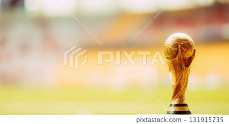 Fifa world cup trophy standing in football stadium 131915735