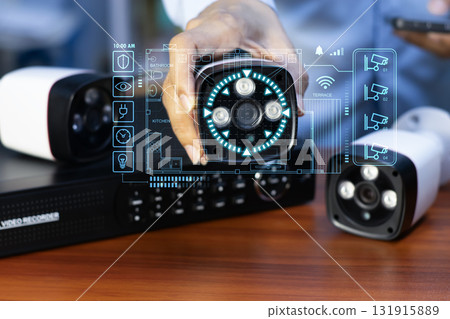 The concept of CCTV and IP camera users setting up camera equipment 131915889