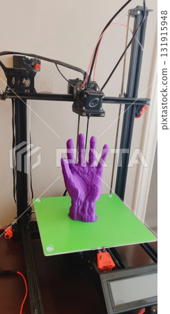 3d printer creating purple plastic hand model prototype 3d printer creating purple plastic hand model prototype 131915948