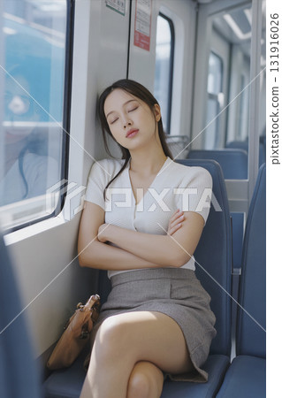 portrait of a young woman hold a basket in the garden 131916026