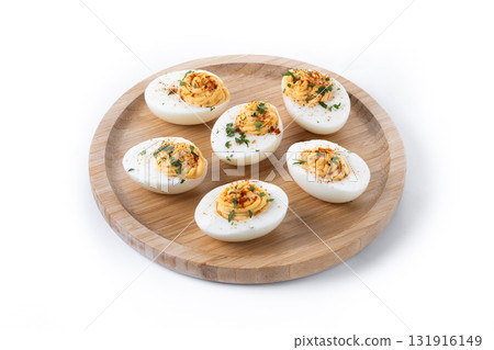 Homemade hard Boiled Deviled Eggs garnished with herbs Homemade hard Boiled Deviled Eggs garnished with herbs 131916149