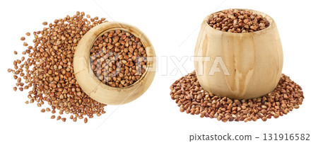 Raw buckwheat in wooden bowl isolated on white background. Top view. Flat lay 131916582