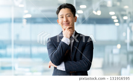 Smiling male businessman Smiling male businessman 131916595