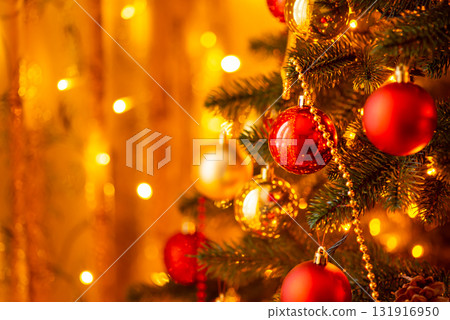 Christmas tree illuminated by bright warm electric garland lights. Beautiful decorated fir tree, New Year celebration Christmas tree illuminated by bright warm electric garland lights. Beautiful decorated fir tree, New Year celebration 131916950