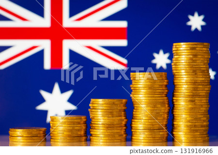 Upcoming graph made of golden coins on the background of flag of Australia. Concept of development, growth, economic progress of Australia 131916966
