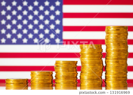 Stacks of golden coins forming upward graph on background of flag of USA. Financial development of USA concept 131916969