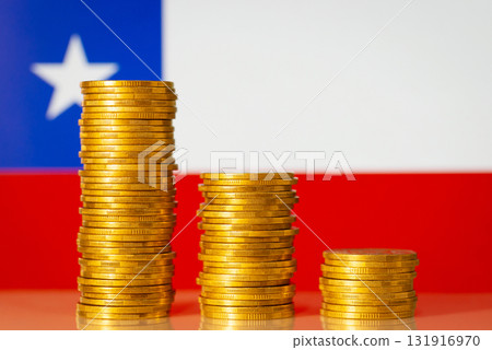 Financial crisis in Chile concept. Descending chart of coins in front of Chile flag 131916970