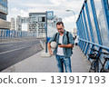Mature man walking home from work, texting on smartphone. 131917193
