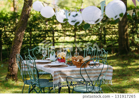 Rustic garden table prepared for summer party. 131917265