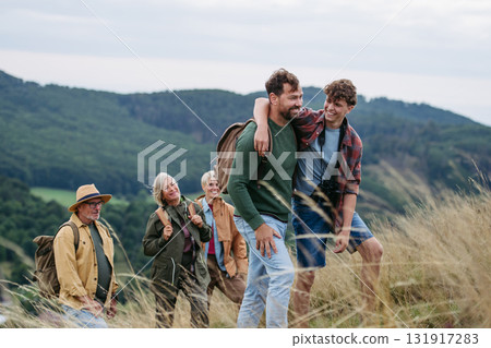 Multigenerational family on hiking trip in nature. Multigenerational family on hiking trip in nature. 131917283