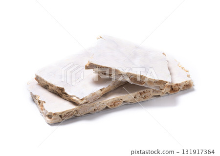 Delicious almond nougat on wooden table. Traditional Christmas sweet 131917364