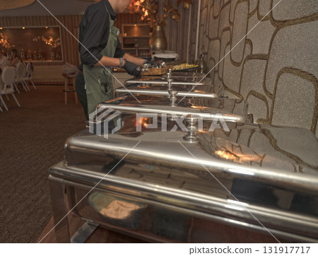 Selective focus. Row of Chafing Dishes at Event Buffet 131917717