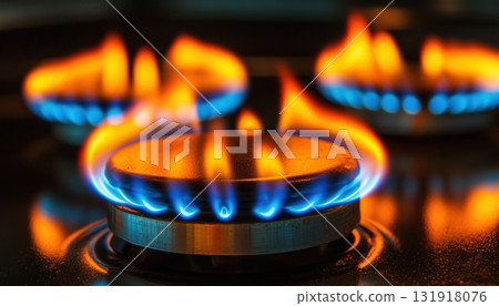 Gas Oven Producing Vibrant Orange Flames With Blue Hues From A Gas Burner 131918076